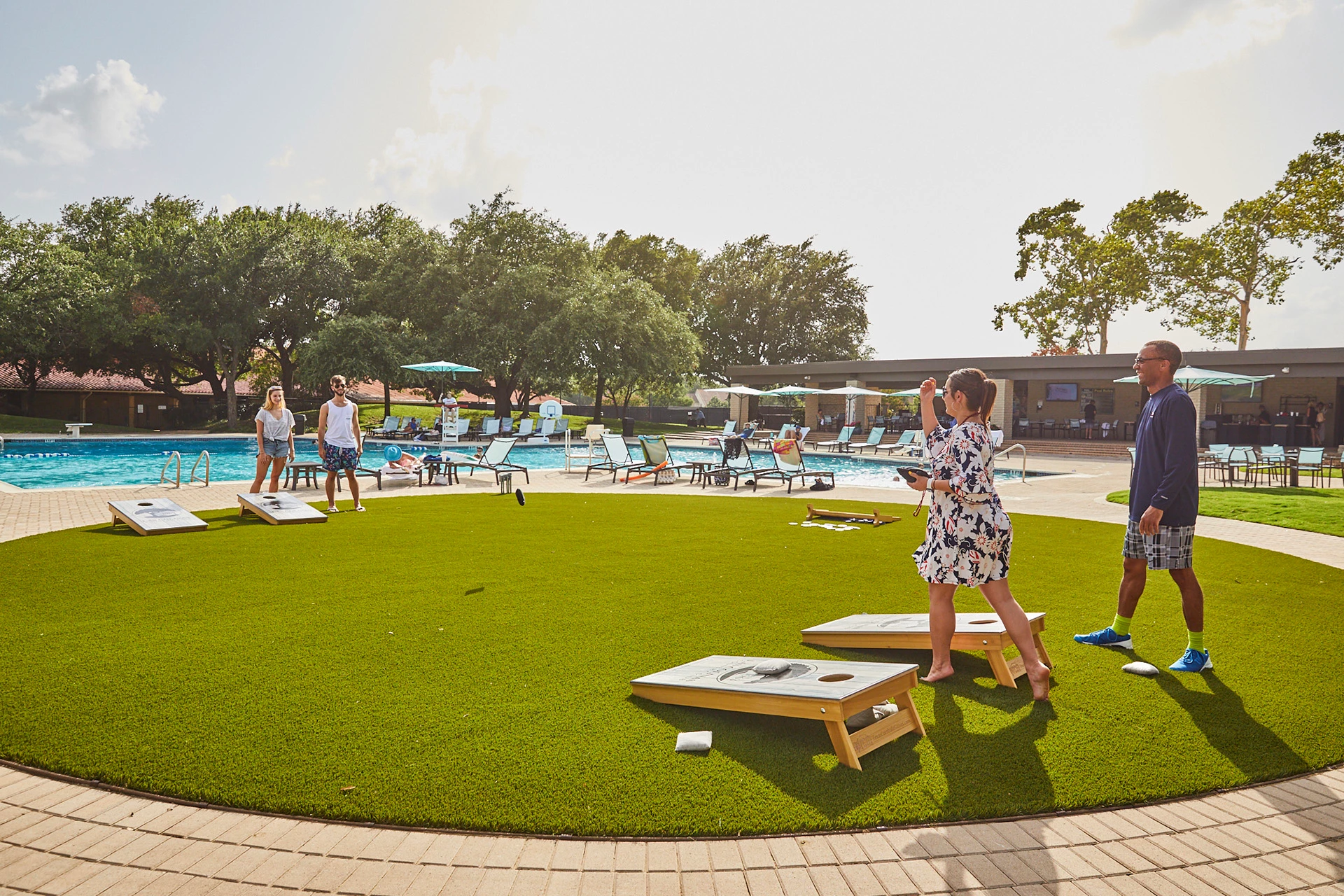 Las Colinas Country Club - Members enjoying games around  pool