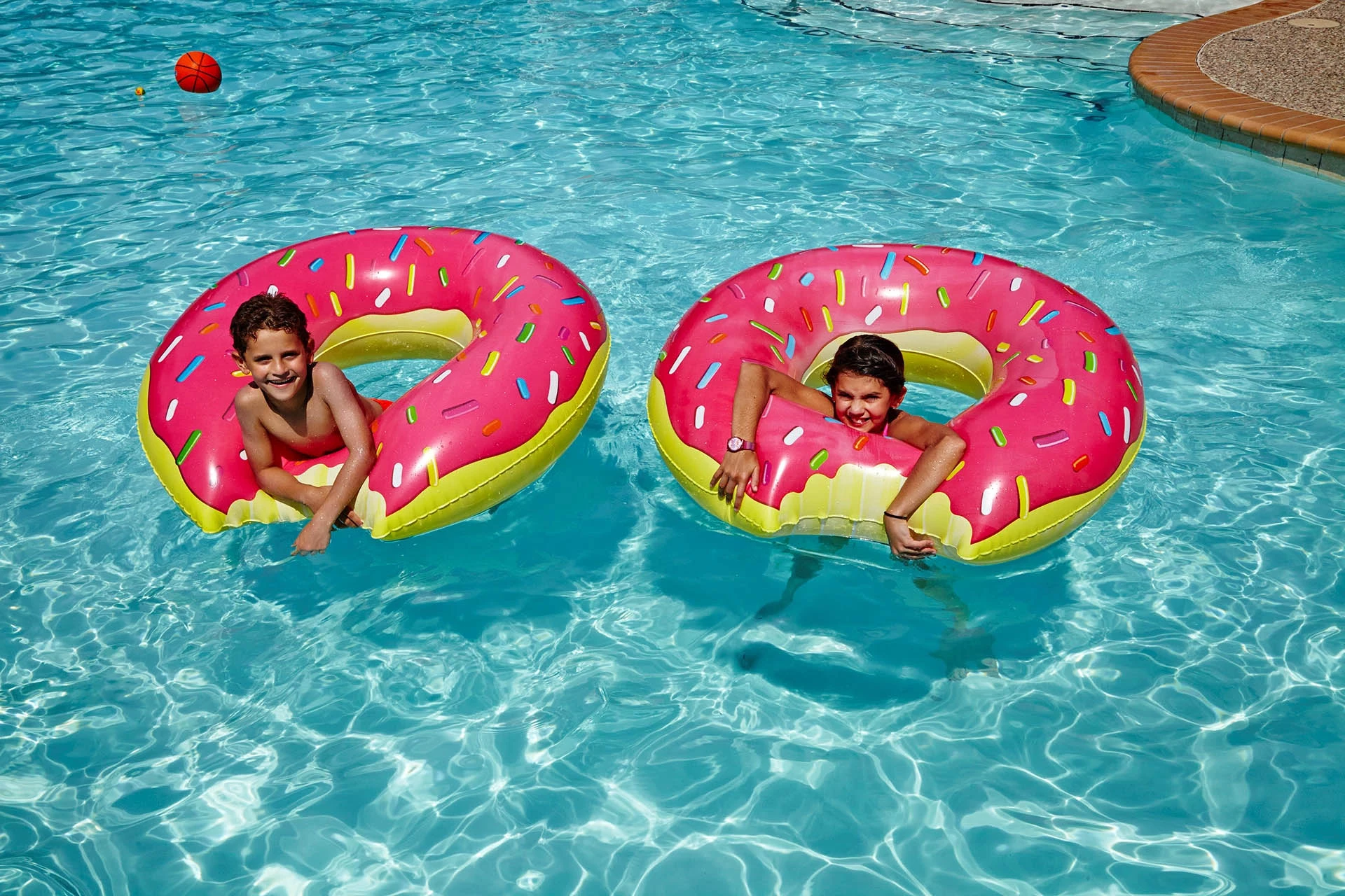 Kids playing in the pool at Woodlands Country Club